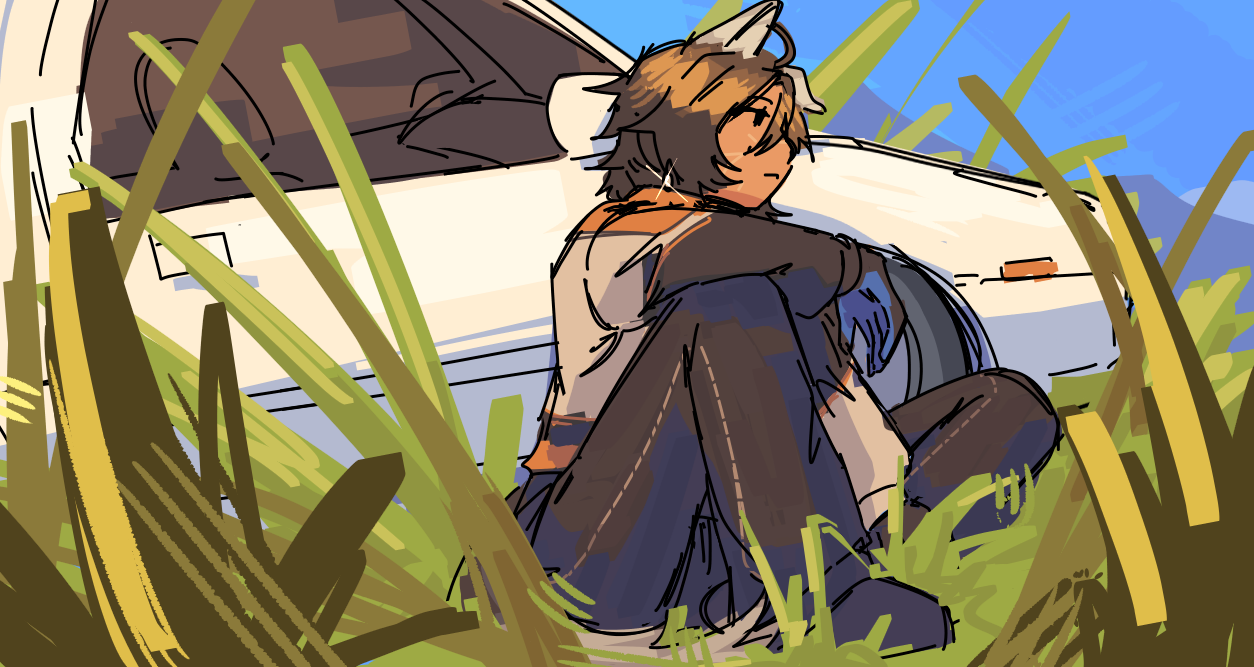 Ethan sitting next to his car in a field of grass, viewed at a low angle.