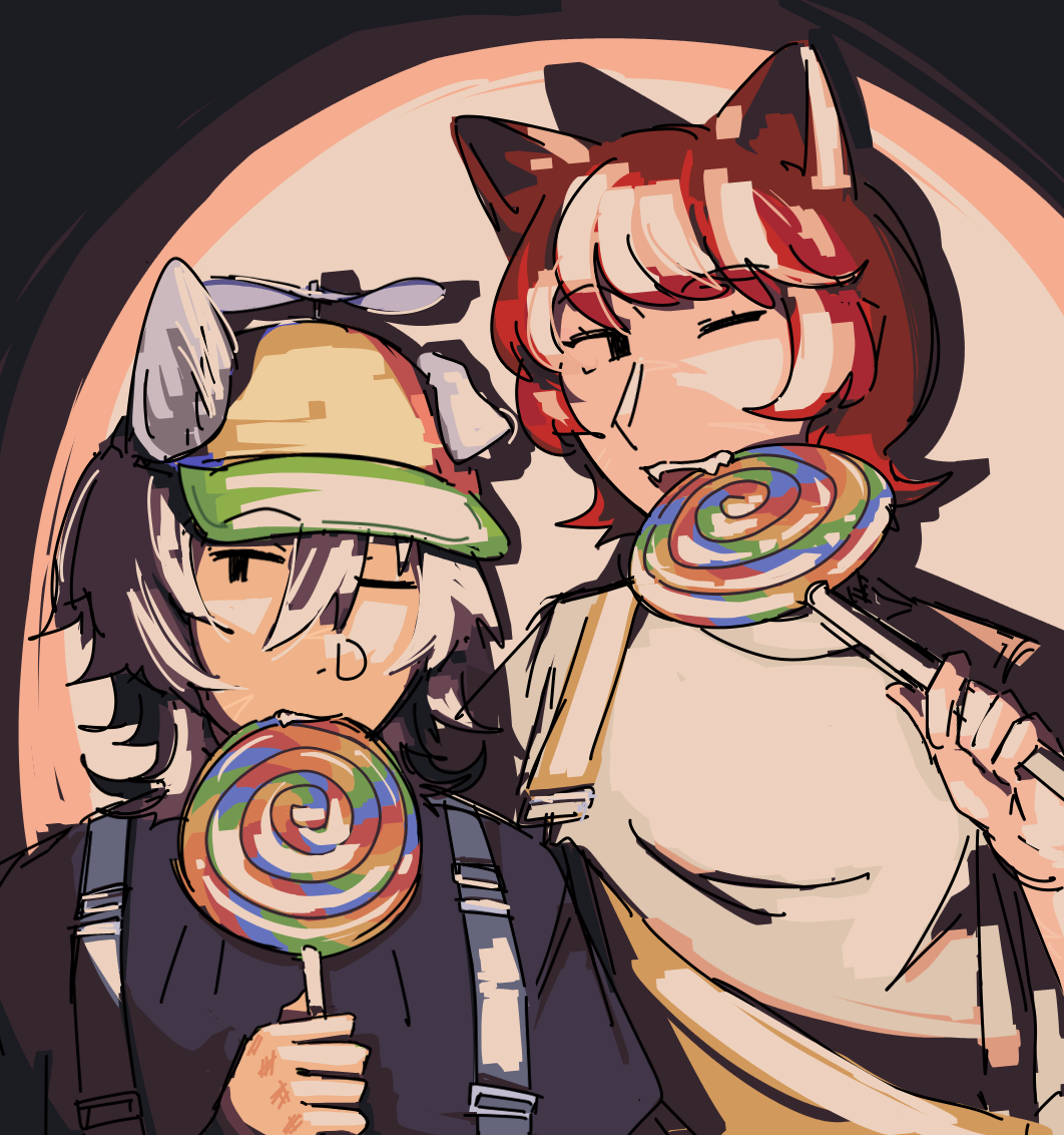 Ethan and Fiore against a bright light, wearing overalls and biting comically large lollipops. Ethan has a propeller hat.